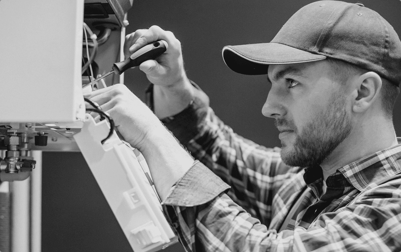 Technician servicing equipment